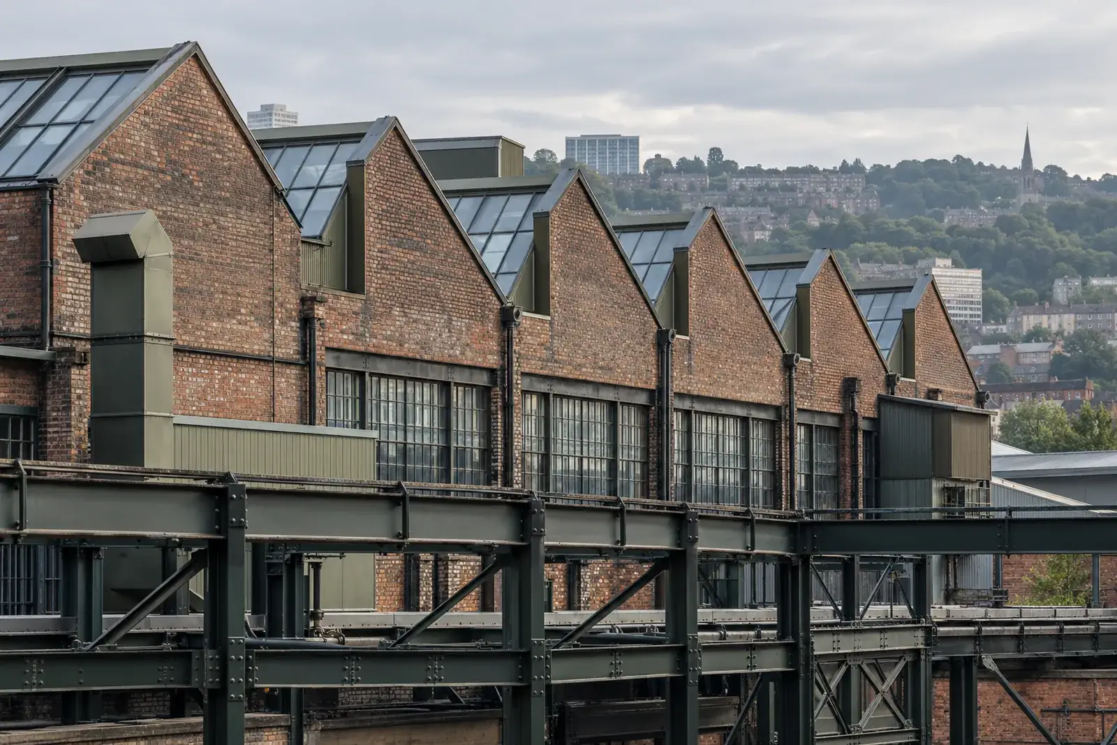 Sawtooth factory roofs and brick industrial buildings illustrating Sheffield’s commercial landscape